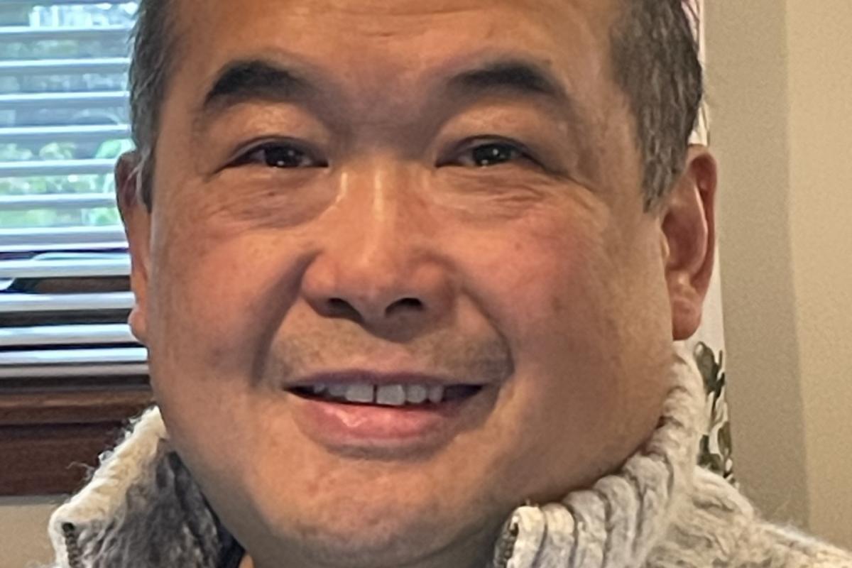 A man smiling at the camera